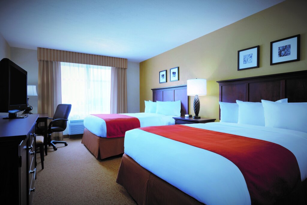 Четырёхместный номер Standard Country Inn & Suites by Radisson, Biloxi-Ocean Springs, MS