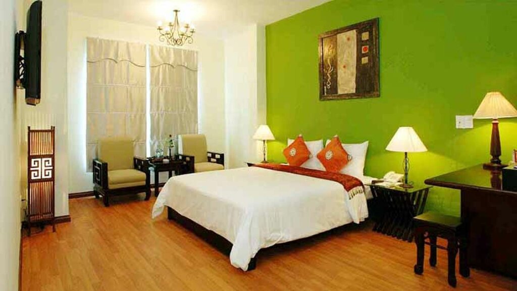 Кровать в общем номере Gold Coast Da Nang Hotel