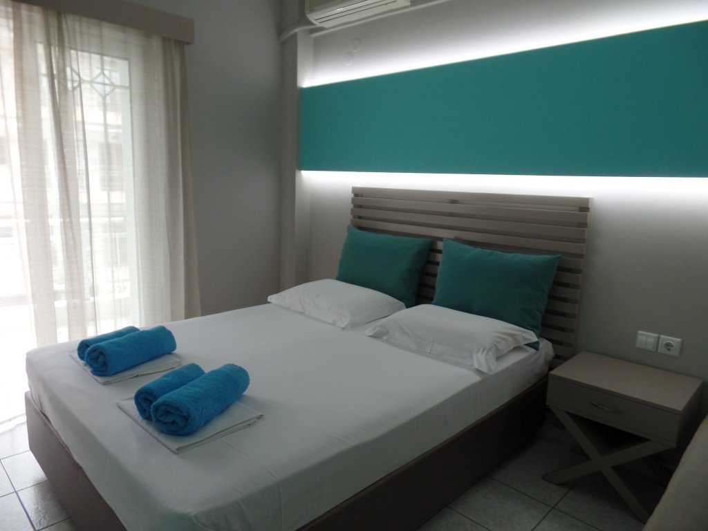 Standard quadruple chambre Ouzas Luxury Hotel