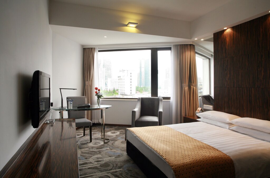 Номер Deluxe City Hotel Shanghai
