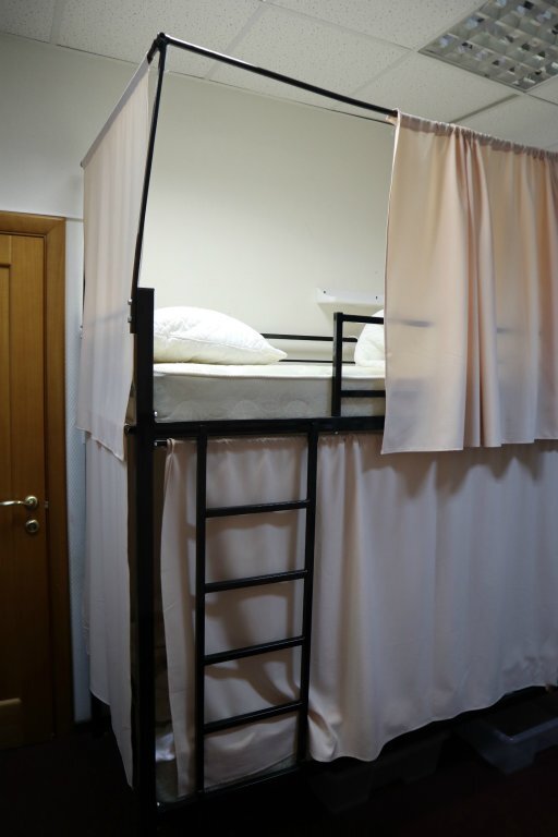 Кровать в общем номере Travel Inn Хостел