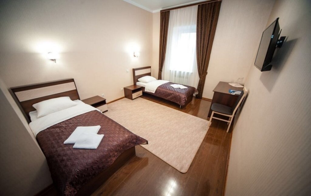 Кровать в общем номере Hotel Rodos