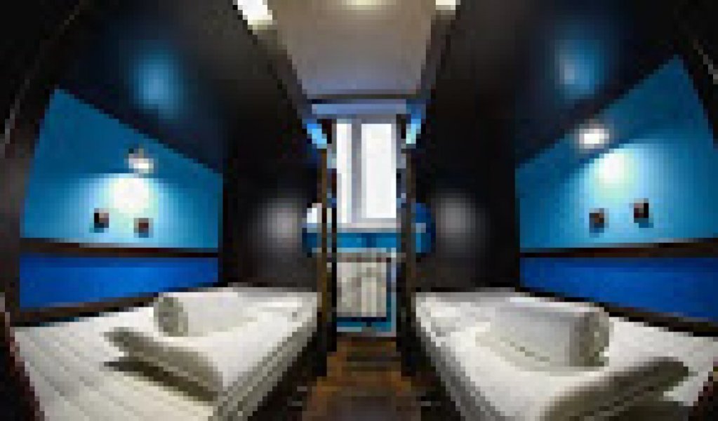 Кровать в общем номере Hotel Nautilus & SPA