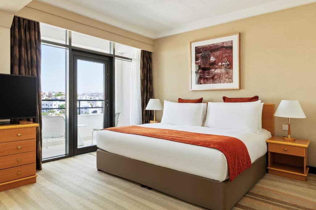 1 Bedroom Double Suite Living Dining Area Crowne Plaza Muscat, an IHG Hotel