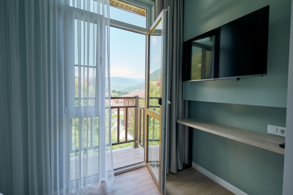 Двухместные апартаменты Premium с 2 комнатами с балконом и с видом на горы Alba Inn Apartments