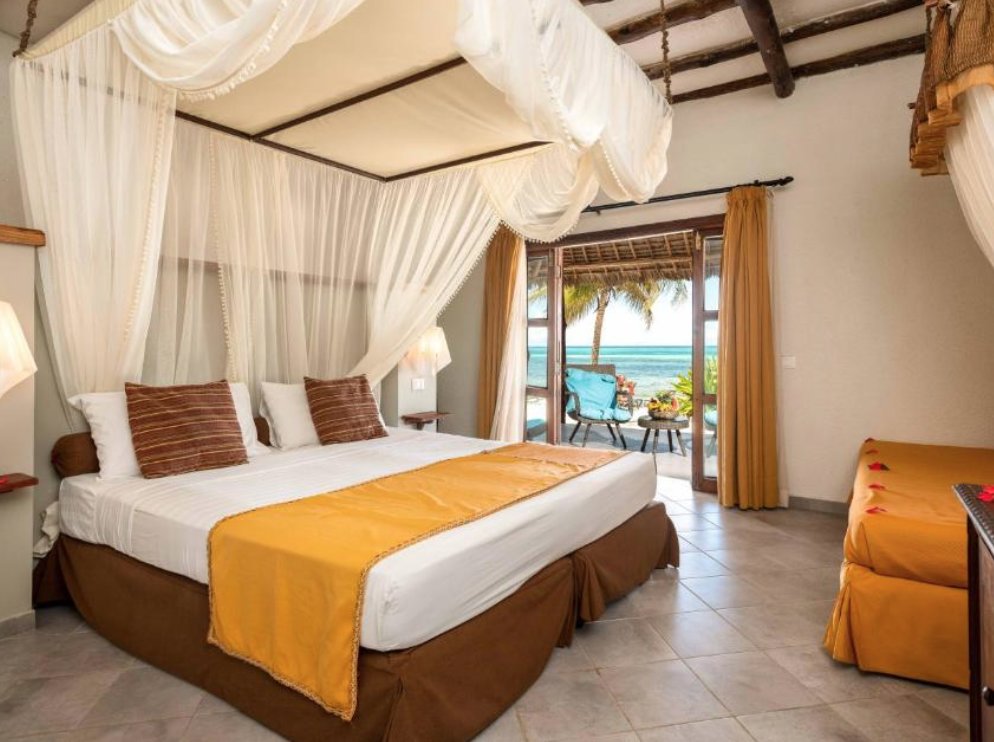 Quadruple Junior Suite with balcony and beachfront Karafuu Beach Resort & Spa